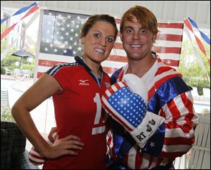 Allison and Zach MacQueen show their national pride at the Olympics kickoff party.