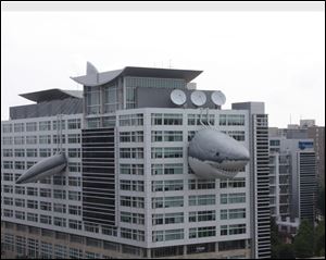 Chompie, a giant inflatable shark, has been installed on the global headquarters building of Discovery Communications. 