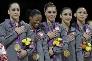 U.S. gymnasts, left to right, Jordyn Wieber, Gabrielle Douglas, McKayla Maroney, Alexandra Raisman and Kyla Ross stand for their national anthem, during the Artistic Gymnastics women's team final at the 2012 Summer Olympics on Tuesday.