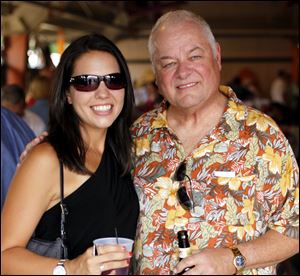 Sheri Bokros and Tom Blaha enjoy libations in the pavilion at the clam bake.