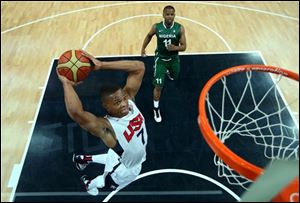 Russell Westbrook (7) of the United States shoots against Richard Oruche (11) of Nigeria during a men's basketball preliminary round match at the 2012 Summer Olympics.