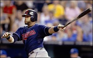 Cleveland Indians' Carlos Santana watches his two-run home run during the fifth inning of a baseball game against the Kansas City Royals at Kauffman Stadium in Kansas City, Mo. on Thursday.