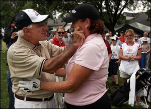 Jamie Farr and Meg Mallon joke around during the pro-am event in 2005. The former Ohio State golfer won four major tournaments.