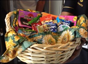 The flight crew of the White House press charter plane offers snacks for the road even after three meals on a five-hour flight from Andrews Air Force Base to Reno, Nev.