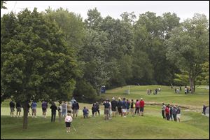 Fans surround the 8th green during the Jamie Farr Toledo Classic at Highland Meadows Golf Club in Sylvania, Ohio.