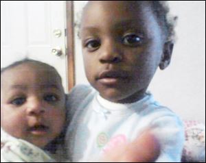 Keondra Hooks, 1, left, was killed by a shot to the head. Sister Leondra Hooks, 2, is hospitalized after being shot in the upper body. 
