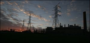 The sun sets on Toledo Edison's Bay Shore power station in Oregon.