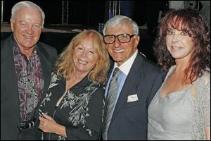 Larry and Sue Resnick pose for a picture with Jamie and Joy Farr during the Hollywood Casino Gala Dinner & Show at the SeaGate Centre in Toledo.