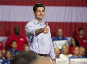 Republican vice presidential candidate Rep. Paul Ryan (R-Wis.) gives a thumbs-up at a rally Sunday in Mooresville, N.C., at the NASCAR Technical Institute. 