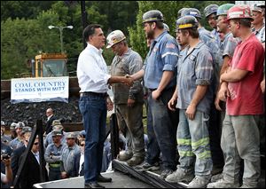 Republican presidential candidate and former Massachusetts Governor Mitt Romney greets coal miners during a campaign rally at American Energy Corportation in Beallsville, Ohio. Mitt Romney is wrapping up his multi state bus tour with campaign events in Ohio.