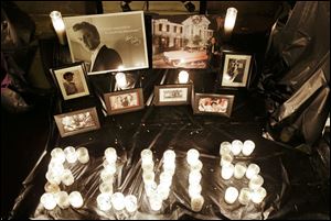 A memorial marking the 35th anniversary of Elvis Presley's death is displayed outside of Graceland.