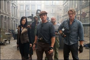 From left, Yu Nan, Terry Crews, Sylvester Stallone, Randy Couture, and Dolph Lundgren in a scene from 