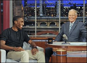 Rogers grad and Olympic silver medalist, Erik Kynard, Jr., left, laughs it up with talk show host David Letterman on Thursday night.