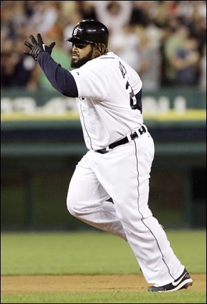 Detroit Tigers' Prince Fielder rounds the bases after hitting a two-run home run to score Miguel Cabrera and tie the game against the Orioles in the sixth inning.