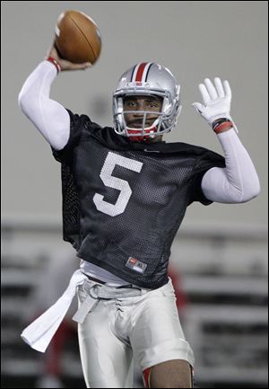 Ohio State's Braxton Miller was pressed into duty last season as a freshman and passed for 1,159 yards. Teammates say the sophomore quarterback became more of a vocal leader during the offseason as he worked with the Buckeyes' wide receivers.