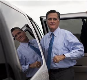 Republican presidential candidate, former Massachusetts Gov. Mitt Romney gets into his car to attend a fundraising event on Saturday, in Nantucket, Mass.