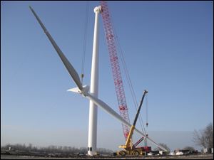 One Energy LLC oversees construction of a 1.5-megawatt turbine at Cooper Farms, a turkey producer in Paulding County. The turbine is expected to generate up to 65 percent of the site's power.