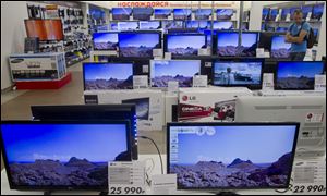 Television sets are on display in a Moscow shop Wednesday.