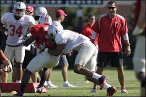Luke Fickell, a former nose tackle for the Buckeyes, is happy to step back from head coaching duties and focus on the defense.