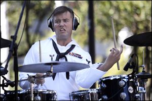Bruce Fisher plays the drums for the Navy Band during the performance at Levis Square.
