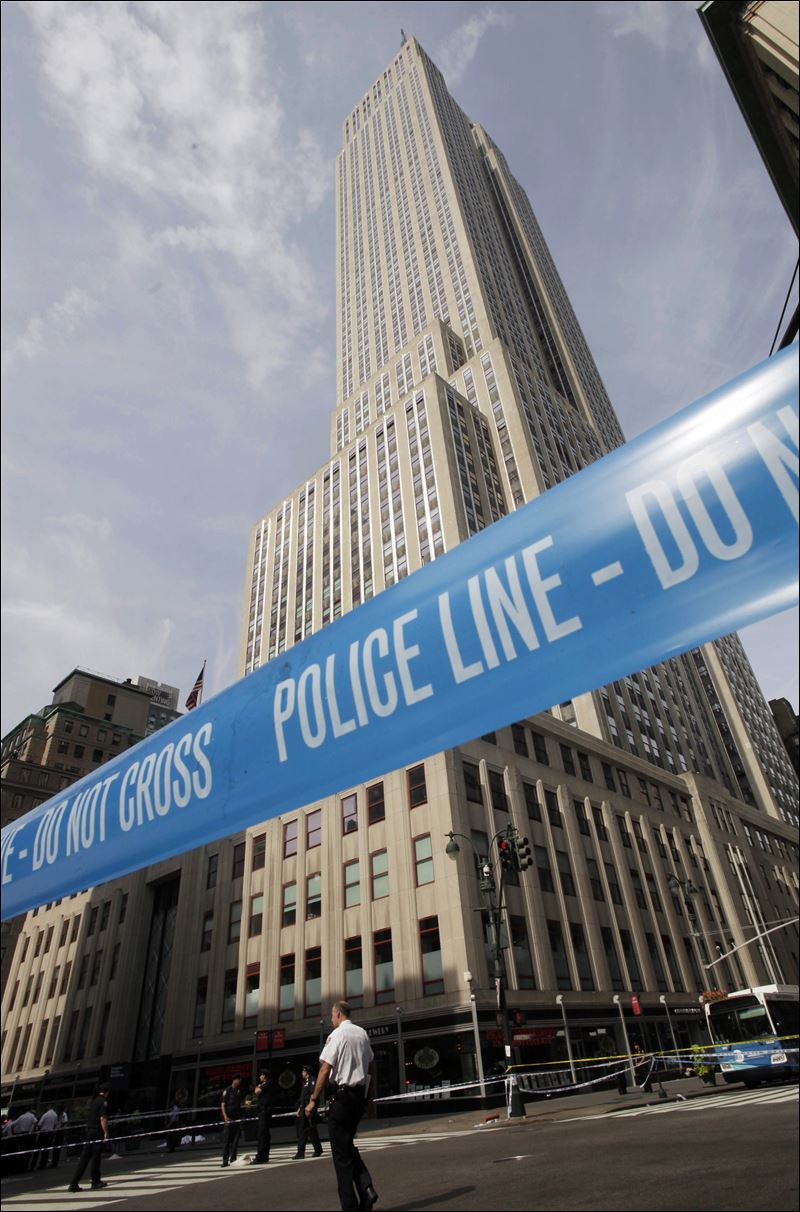 Gunman kills ex-colleague, 9 others wounded near Empire State ...