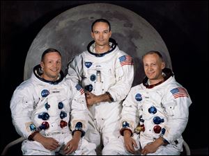 In this 1969 photo provided by NASA the crew of the Apollo 11 mission is seen. From left are Neil Armstrong, Mission Commander, Michael Collins,  Lt. Col. USAF, and Edwin Eugene Aldrin, also known as Buzz Aldrin, USAF Lunar Module pilot.  The family of Neil Armstrong, the first man to walk on the moon, says he has died at age 82. A statement from the family says he died following complications resulting from cardiovascular procedures. It doesn't say where he died. Armstrong commanded the Apollo 11 spacecraft that landed on the moon July 20, 1969. He radioed back to Earth the historic news of 