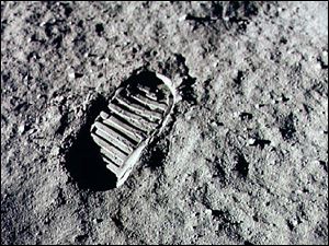 Neil Armstrong steps into history July 20, 1969 by leaving the first human footprint on the surface of the moon. The 30th anniversary of the Apollo 11 Moon mission is celebrated July 20, 1999.