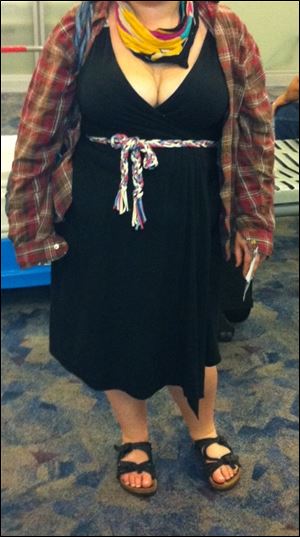 In this Spring 2012 photo provided by a woman identified as Avital and made available to the blog Jezebel, Avital poses for a picture at McCarran International Airport in Las Vegas, showing what she was wearing after she says a Southwest Airlines gate agent approached her, alleging she was showing too much cleavage.