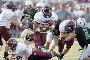 Genoa’s Kyle Nutter scores a touchdown in the first quarter against Ottawa Hills. The All-Ohio running back gained 237 yards on 16 carries. The Comets had 553 rushing yards.