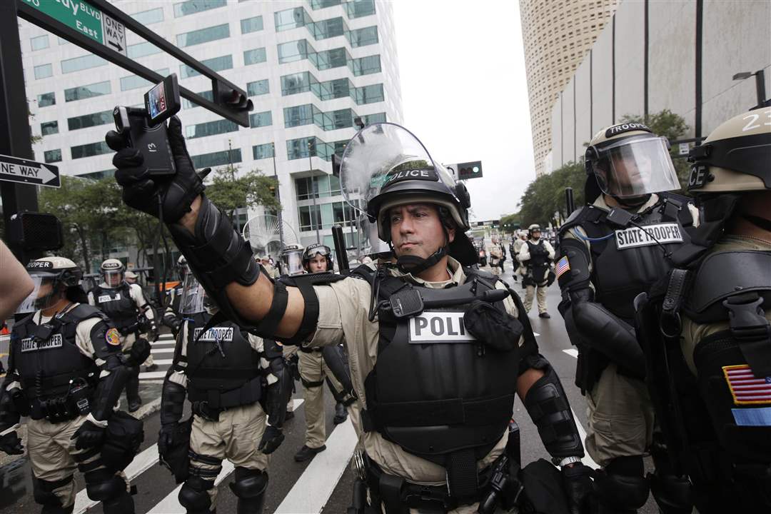 Republican-Convention-Protests-officer-camera