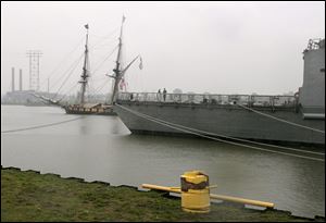 The U.S. Brig Niagara passes the USS De Wert as it heads down the Maumee toward Lake Erie.