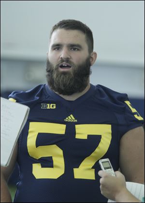 Elliott Mealer, a 6-foot-5, 308-pound redshirt senior from Wauseon, will start at left guard when Michigan opens the season Saturday.