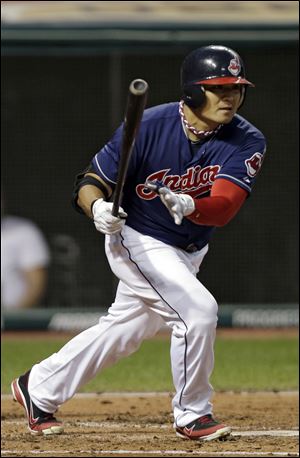 Cleveland Indians' Shin-Soo Choo singles off Oakland Athletics starting pitcher Tommy Milone in the third inning of a baseball game Tuesday in Cleveland. 