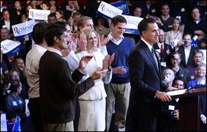 Mitt Romney celebrates with sons, from left, Matt, Tagg, Craig, Ben, Josh and wife Ann, after his New Hampshire Primary Election win on Jan. 10 in Manchester, N.H.