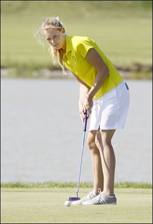 Notre Dame Academy golfer Paige Kasper putts for a birdie on the fourth hole at Maumee Bay Golf Course.
