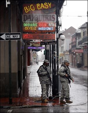 Members of the Army National Guard patrol Bourbon Street in the French Quarter as Hurricane Isaac makes landfall Wednesday in New Orleans.