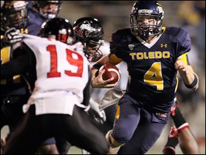 University of Toledo Qb Austin Dantin (4) runs the ball against Northern Illinois November 11, 2011.