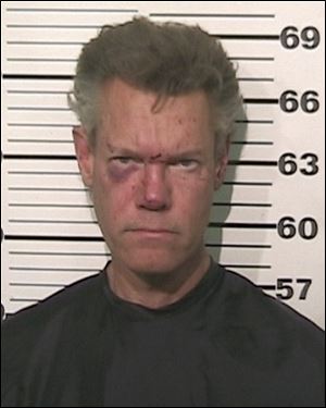 This photo provided by the Grayson County, Texas, Sheriffs Office shows Country singer Randy Travis was charged with driving while intoxicated. Travis was released on $21,500 bond Aug. 8.