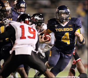 University of Toledo Qb Austin Dantin (4) runs the ball against Northern Illinois November 11, 2011.