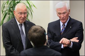 Astronauts Jim Lovell, left, and Gene Cernan, right, talk with Shane DiGiovanna on Friday at Children's Hospital in Cincinnati. DiGiovanna, who has a rare connective disease, is a patient at the hospital. Lovell and Cernan were launching the Neil Armstrong New Frontiers Initiative, a children's health fund in memory of Armstrong being put in place at the hospital.