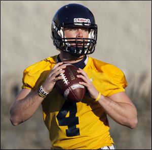 Toledo quarterback Austin Dantin looks to throw the ball during practice. Dantin will start Saturday against Arizona.