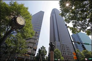 Independence Square in downtown Charlotte, N.C., is one of several places that will draw delegates who are in town fo the Democratic National Convention. The bronze statue is one of four at the intersection of Trade and Tryon streets representing commerce, transportation, energy and the future. 
