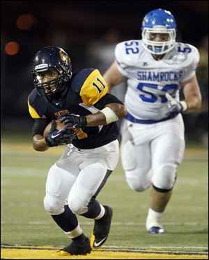 Whitmer's Me'Gail Frisch racks up some yardage. He ran for 109 yards.