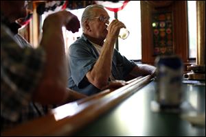 Bob Bartlett, 71, has a beer at G & L Fire Escape in Chicago. Mr. Bartlett, a retired lithographer, can remember when early-morning bars stood at more street corners. 