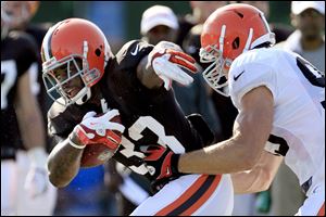 Coming off a dismal 4-12 season, their eighth in nine years of at least 10 losses, rookie running back Trent Richardson, left, and the Browns enter 2012 with high hopes and low expectations. The Browns open the season Sunday at home against the Philadelphia Eagles.