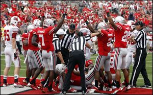 Ohio State celebrates Bradley Roby's touchdown after he recovered a fumble in the third quarter.