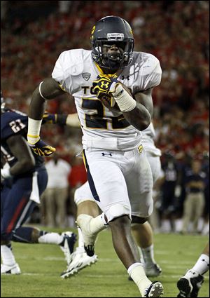 Toledo's David Fluellen runs into the end zone against Arizona on Saturday night in Tucson, Ariz. The Wildcats had a 624-358 advantage in total yards.