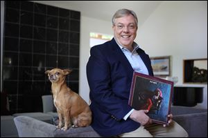 Lake Forest, Illinois economist Mike Moebs, seen here with Missy, revamped his personal and business trusts to include all his digital assets, including the Janis Joplin album 