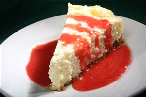 Cheesecake with strawberry coulis.