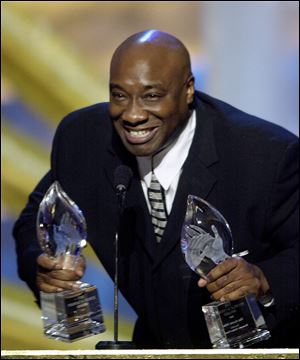 Actor Michael Clarke Duncan accepts two awards for the film 